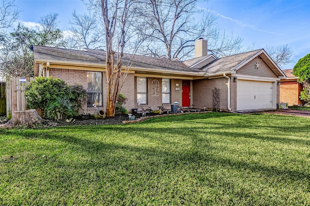 single story home featuring a garage and a front lawn