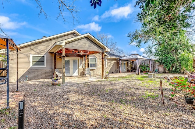 back of house featuring a gazebo, a patio area, and french doors