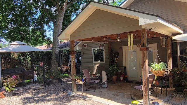 back of house featuring a patio and ceiling fan