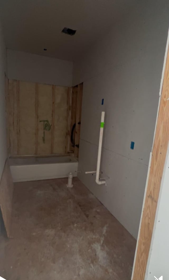 bathroom with concrete flooring