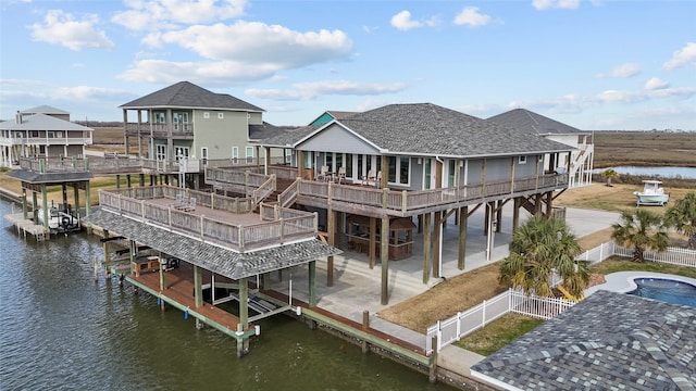 exterior space featuring a deck with water view