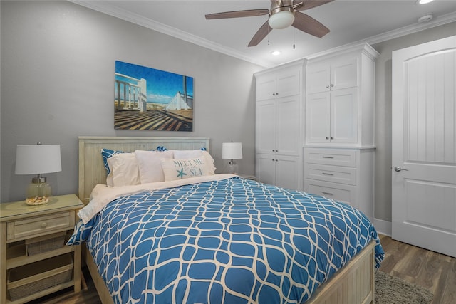 bedroom featuring crown molding, ceiling fan, dark hardwood / wood-style floors, and a closet