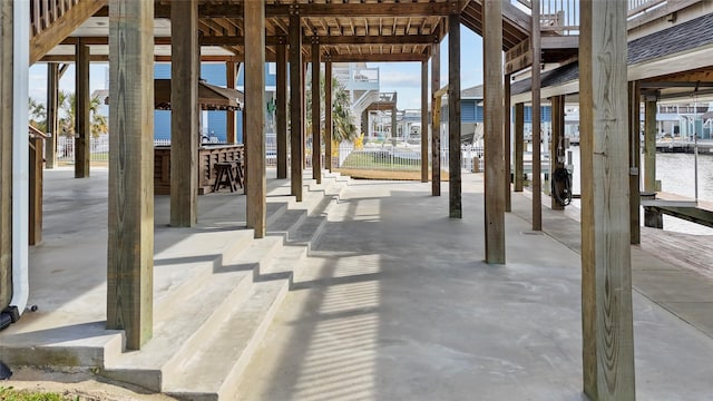 view of patio featuring a water view and a gazebo