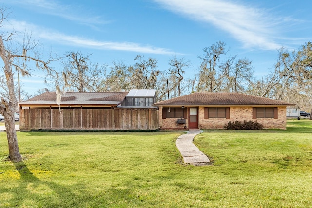 back of house featuring a lawn