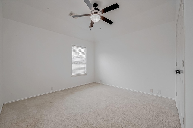 empty room with light colored carpet and ceiling fan