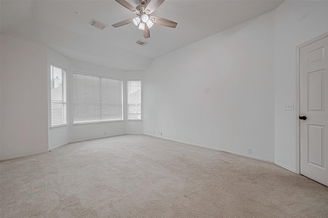 spare room featuring ceiling fan and light colored carpet