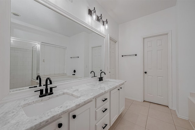 bathroom featuring vanity, an enclosed shower, and tile patterned flooring