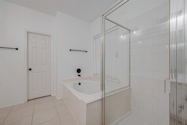 bathroom with tile patterned flooring and independent shower and bath