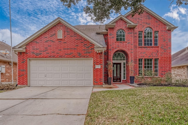 view of front property featuring a garage and a front yard