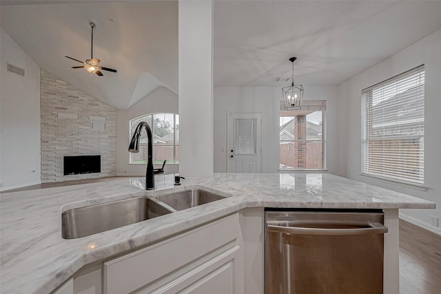 kitchen featuring white cabinetry, sink, plenty of natural light, and dishwasher