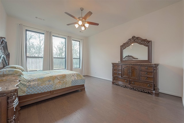 bedroom with wood-type flooring and ceiling fan