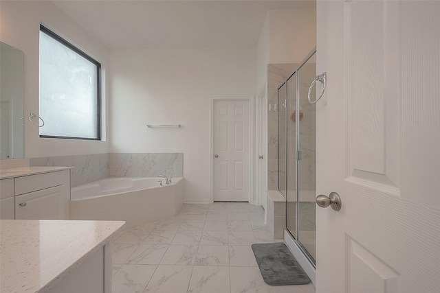 bathroom featuring vanity and shower with separate bathtub