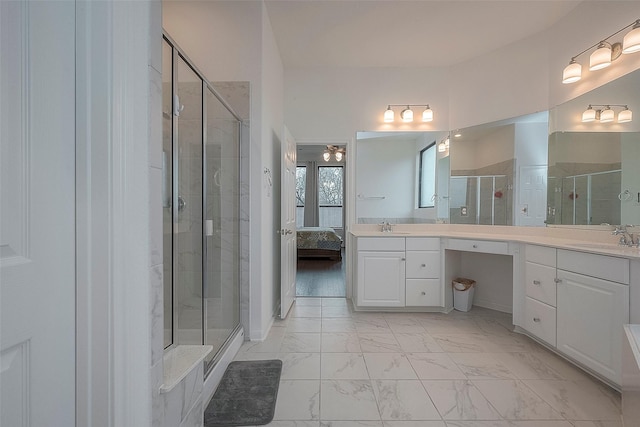 bathroom featuring walk in shower and vanity