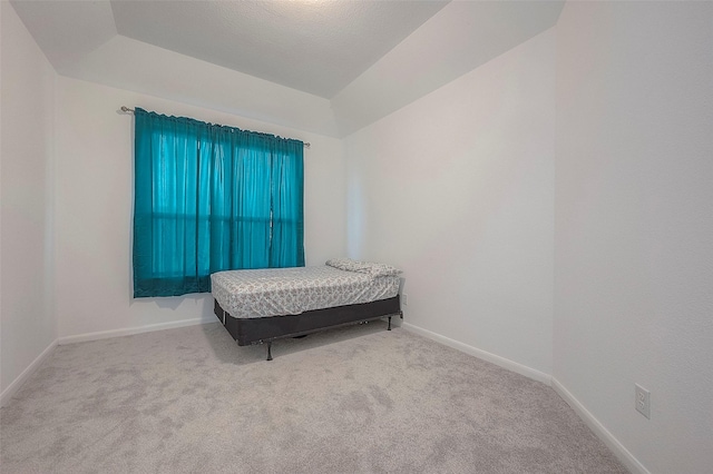 bedroom featuring light colored carpet