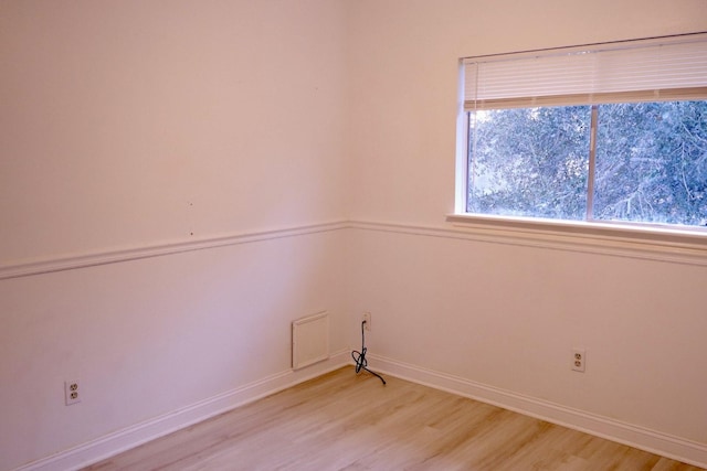 spare room with light wood-type flooring