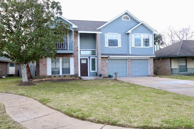 view of front of home with a garage and a front lawn