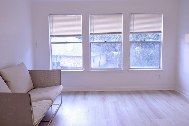 unfurnished room with light wood-type flooring