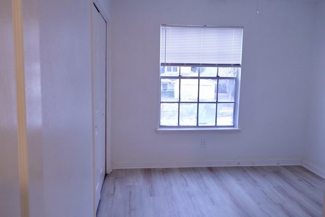 unfurnished room with light hardwood / wood-style floors