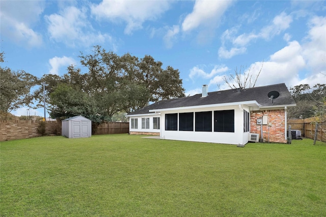 back of property with cooling unit, a storage shed, a yard, and a sunroom