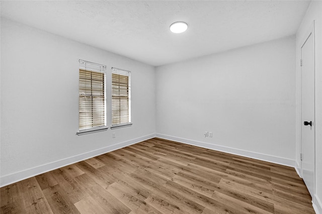 empty room featuring wood-type flooring