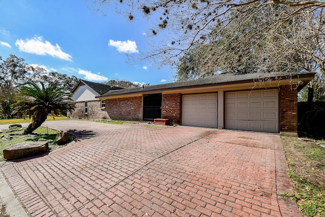 ranch-style home with a garage