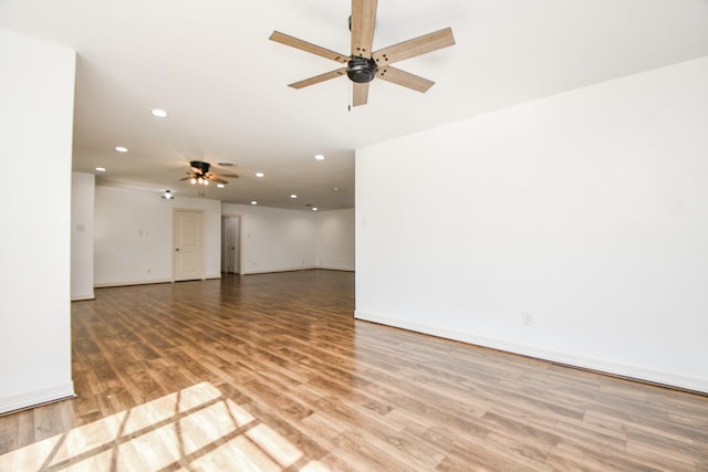 unfurnished room with hardwood / wood-style flooring and ceiling fan