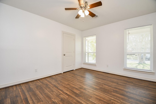 unfurnished room featuring ceiling fan and dark hardwood / wood-style flooring