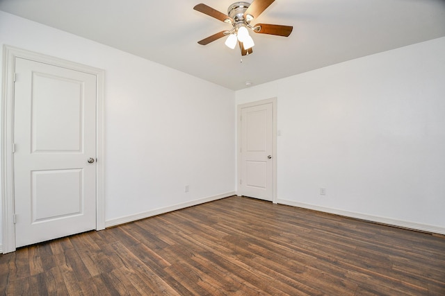 unfurnished room featuring ceiling fan and dark hardwood / wood-style flooring