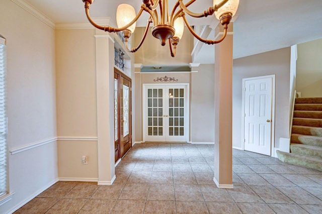 foyer featuring an inviting chandelier, crown molding, tile patterned floors, and french doors