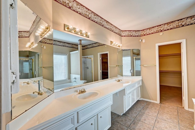 bathroom featuring tile patterned flooring, plus walk in shower, and vanity