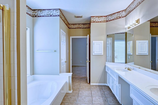 bathroom featuring vanity, a bath, and tile patterned floors