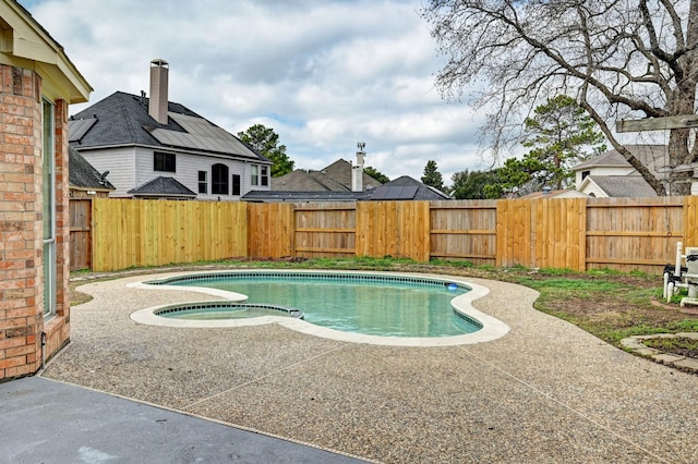 view of pool with an in ground hot tub and a patio area