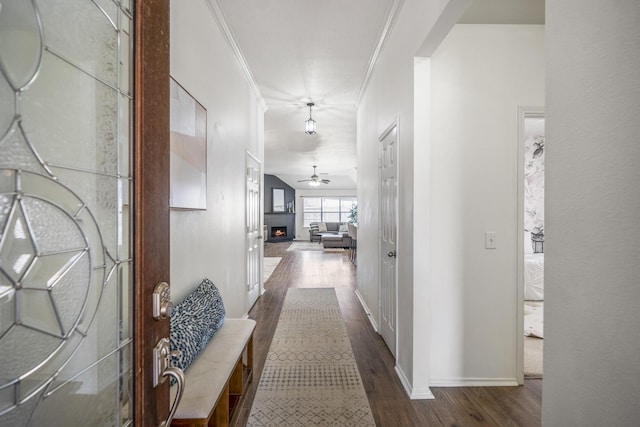 corridor featuring crown molding and wood-type flooring