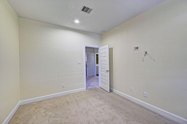 empty room with light colored carpet