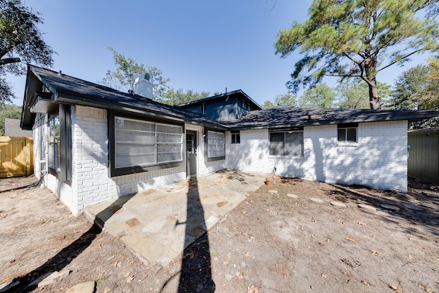 back of property featuring a patio