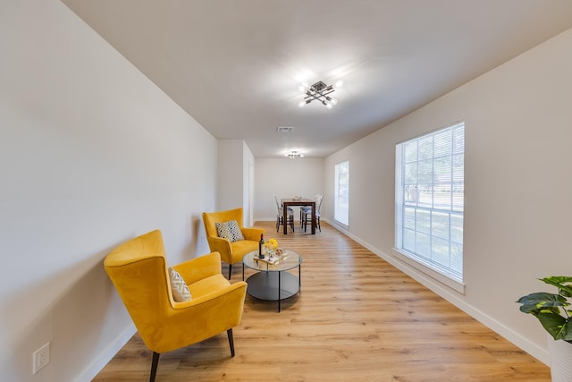 living area with light hardwood / wood-style floors