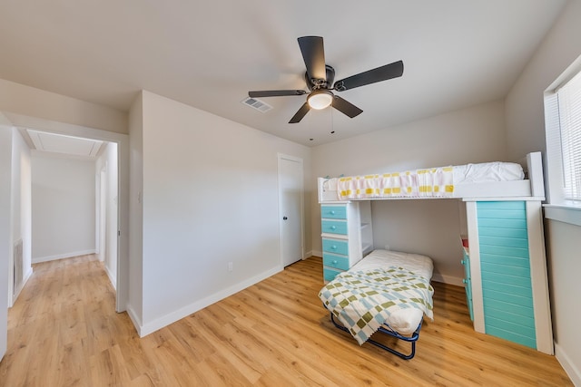 bedroom featuring light hardwood / wood-style flooring and ceiling fan