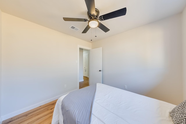 bedroom with ceiling fan and light hardwood / wood-style flooring