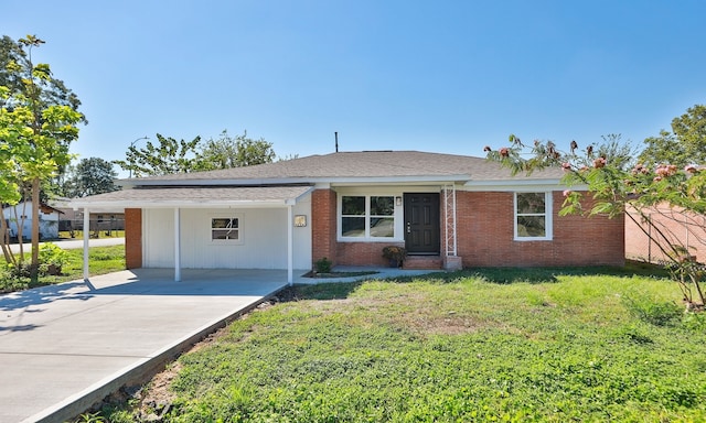 ranch-style house with a front yard and a carport