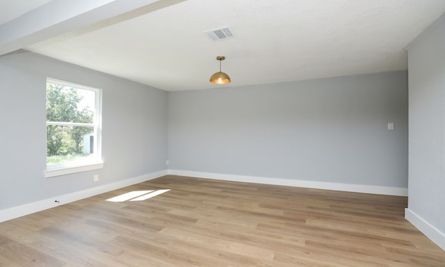 unfurnished room featuring light hardwood / wood-style floors