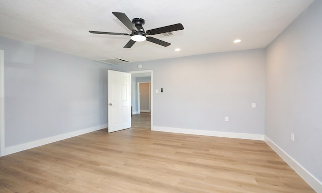 unfurnished room with ceiling fan and light hardwood / wood-style flooring