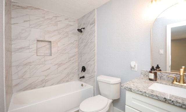 full bathroom with vanity, toilet, and tiled shower / bath