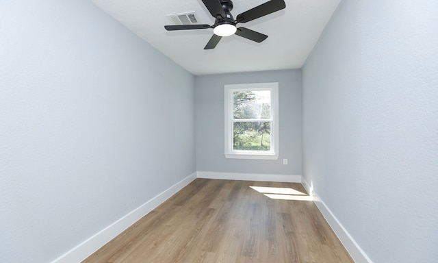 empty room featuring ceiling fan and light wood-type flooring