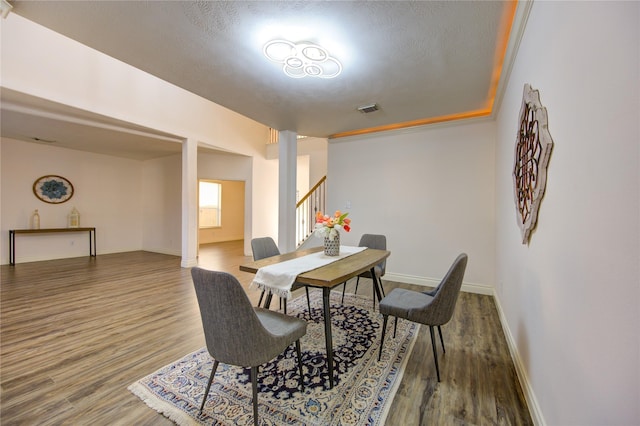 dining area with hardwood / wood-style floors