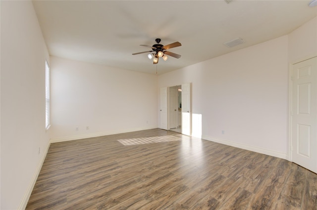 spare room featuring ceiling fan and dark hardwood / wood-style flooring