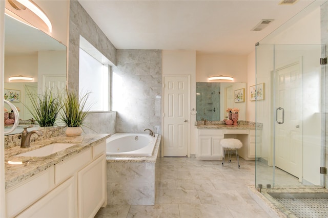 bathroom featuring vanity and shower with separate bathtub