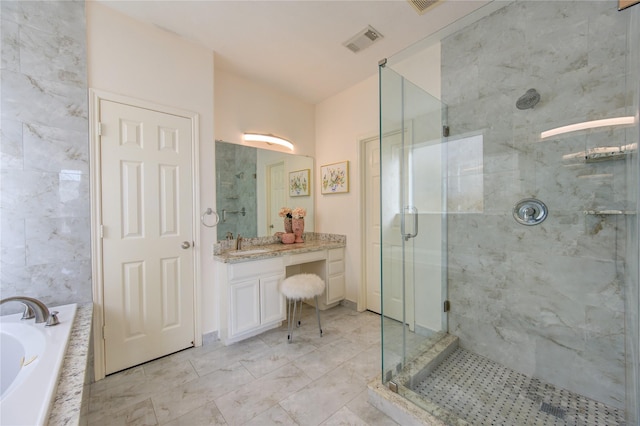 bathroom featuring vanity and separate shower and tub