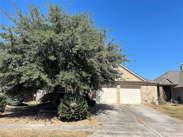 obstructed view of property with a garage