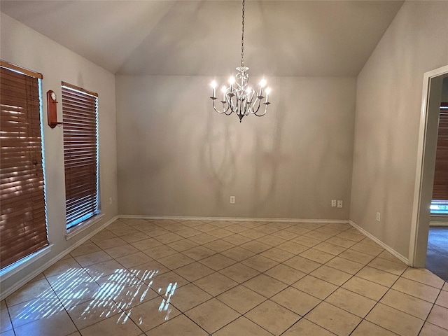 unfurnished dining area featuring light tile patterned flooring, lofted ceiling, and a chandelier