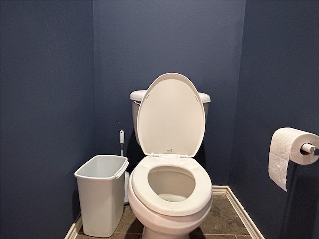 bathroom with toilet and tile patterned flooring